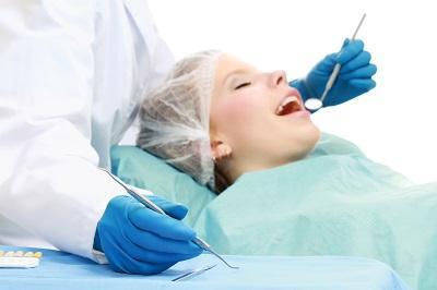 A woman under IV sedation at the dentist